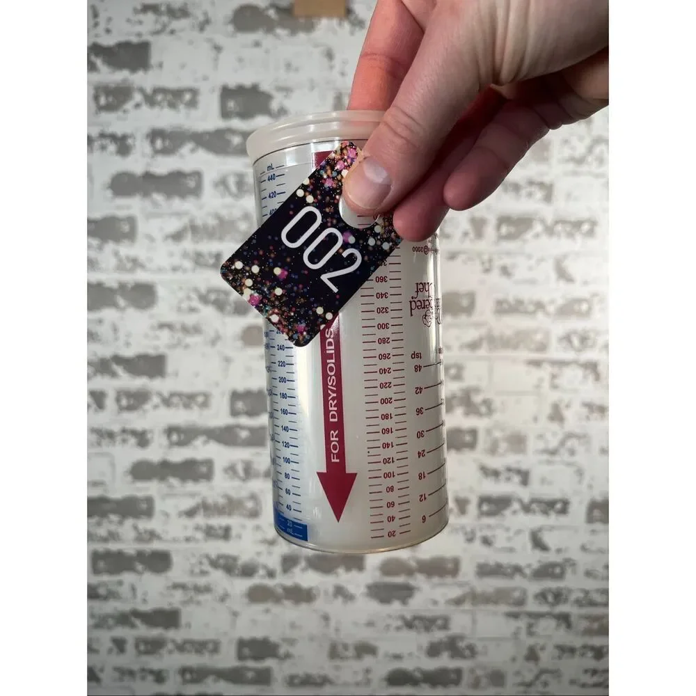 Pampered chef | wet and dry measuring cup dispenser